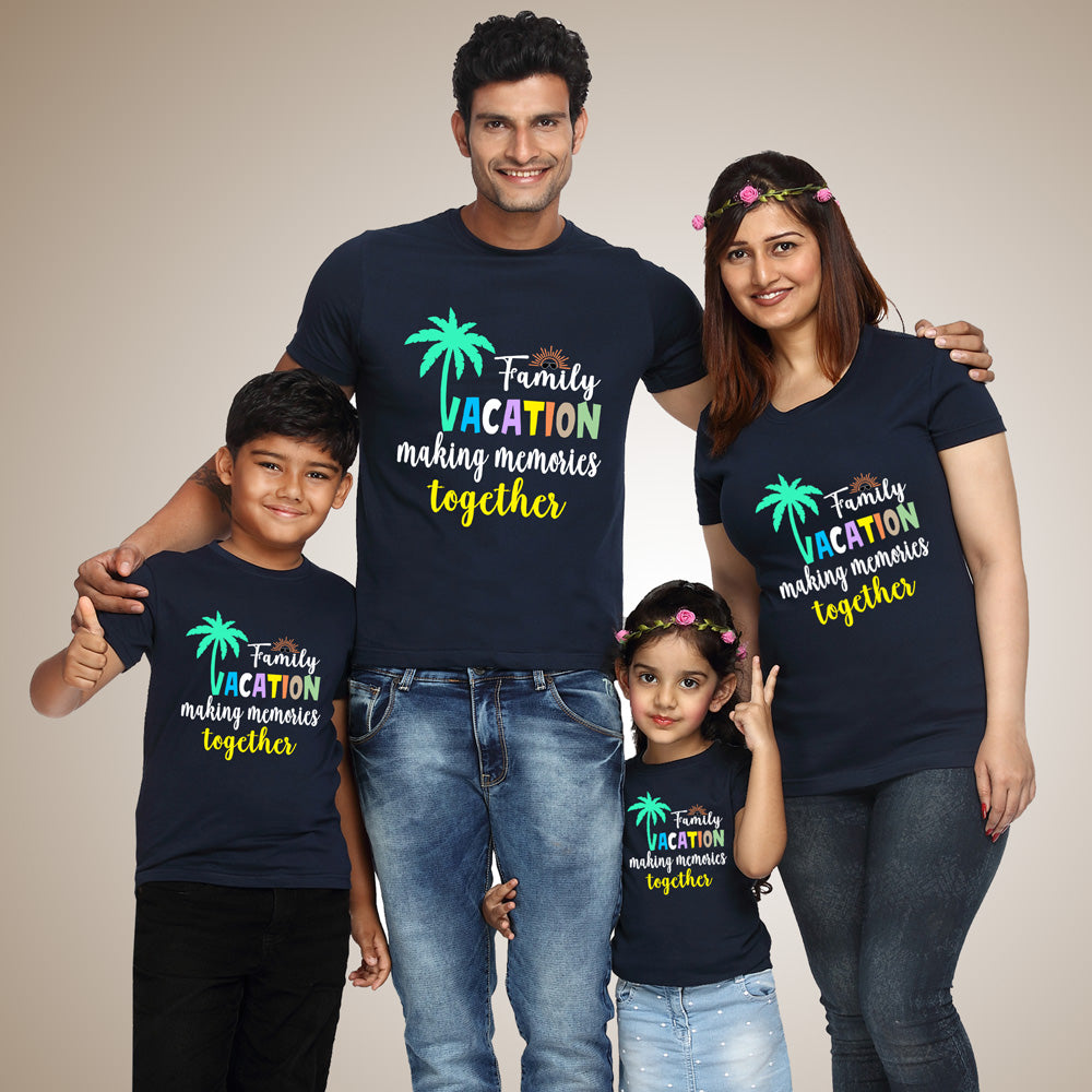 Family of four wearing matching navy blue t-shirts with a family vacation design.