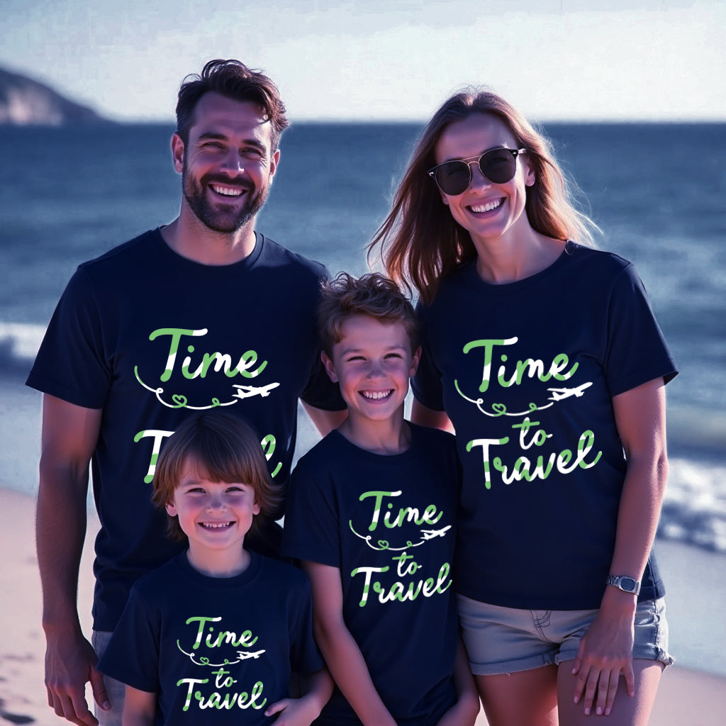 Family of four wearing matching t-shirts with 'Time to Travel' text on a beach.