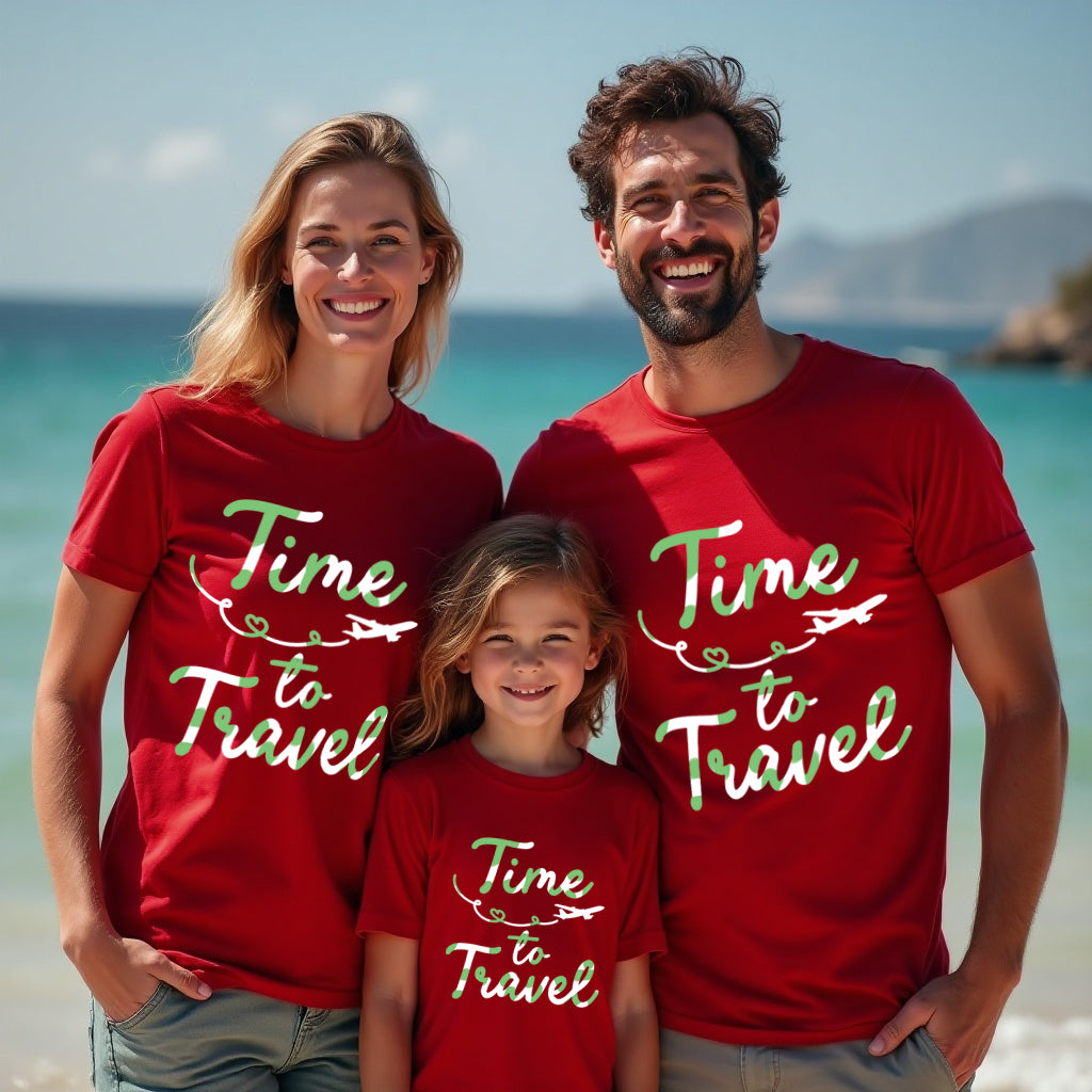 Family of three wearing red 'Time to Travel' t-shirts on a beach.