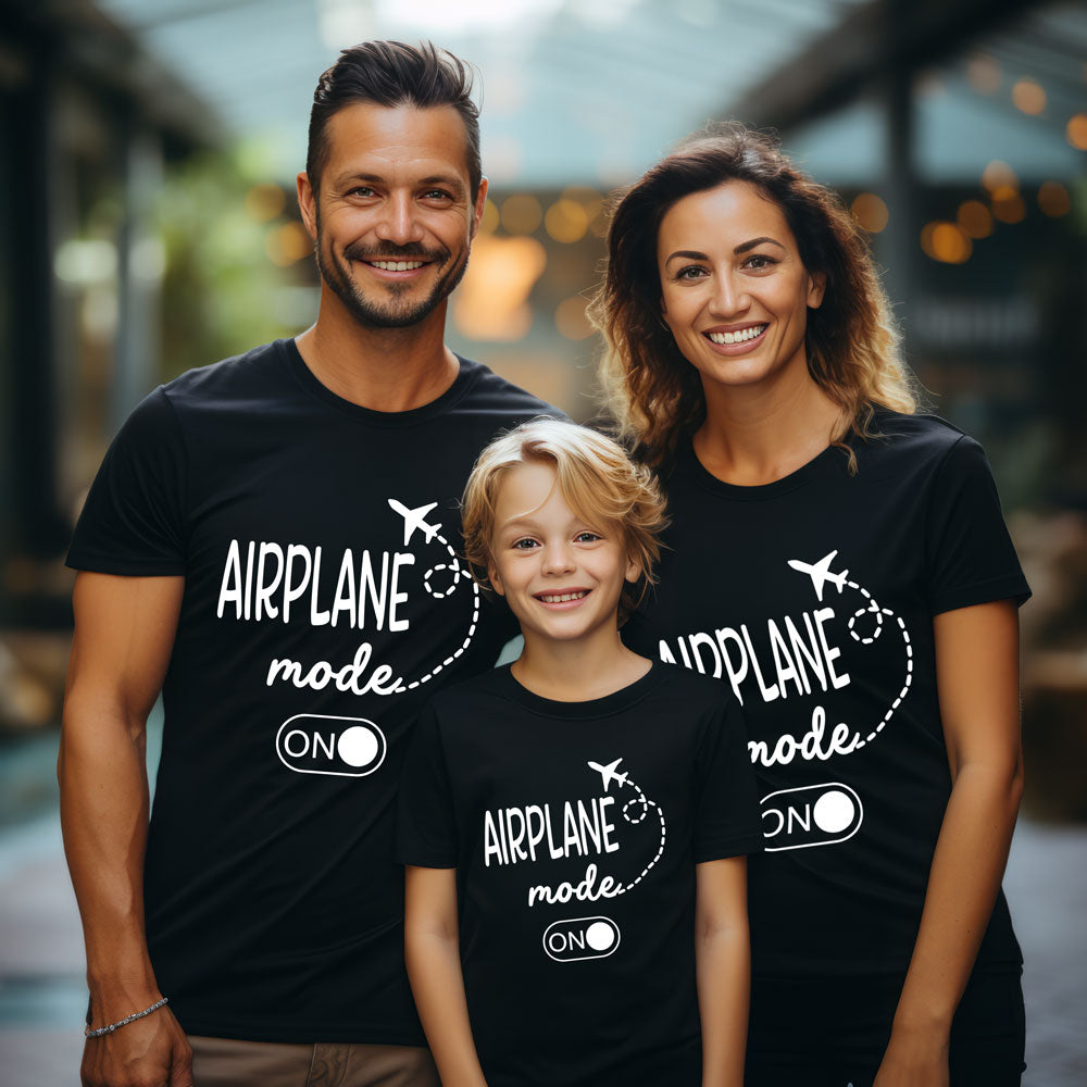Family of three wearing black t-shirts with 'Airplane mode ON' text.