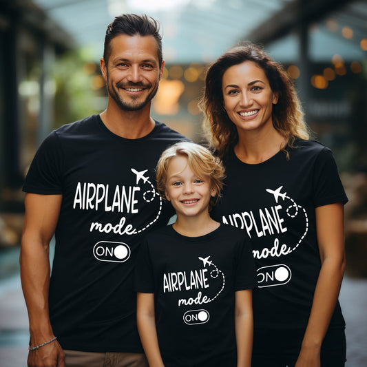 Family of three wearing black t-shirts with 'Airplane mode ON' text.
