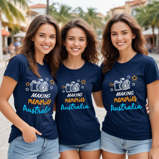 Three women wearing navy blue t-shirts with 'Making Memories Australia' text and camera graphic.