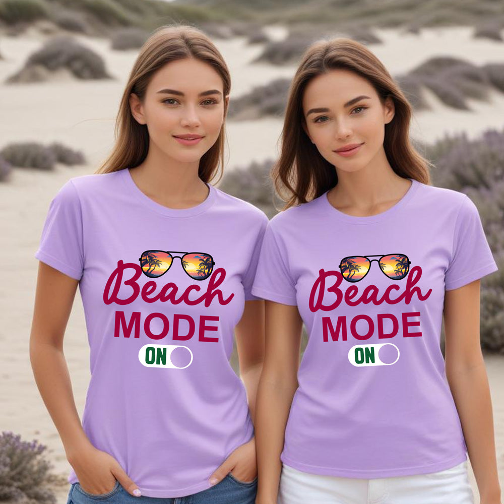 Two women wearing purple t-shirts with 'Beach Mode ON' text in a lavender field.