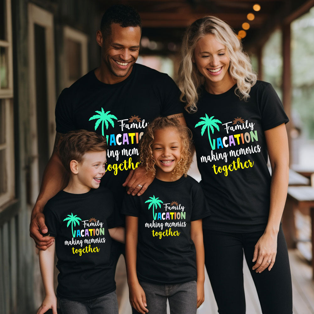 Family of four wearing matching black t-shirts with colorful text and graphics.