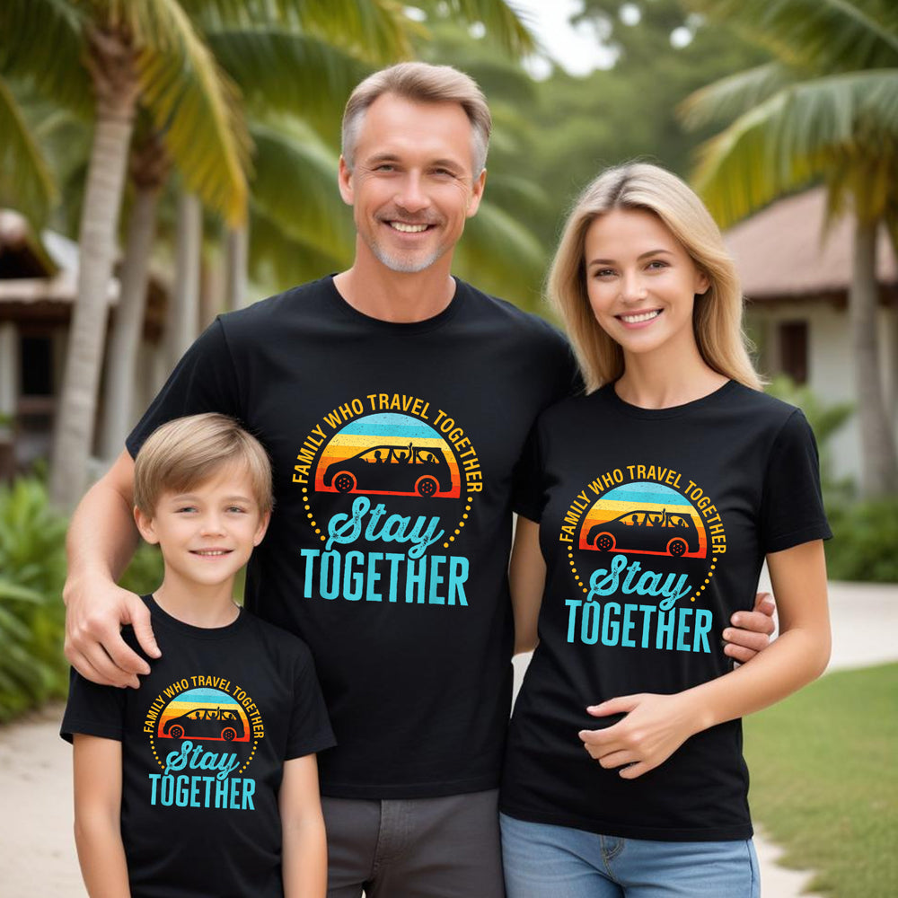 Family of three wearing matching black t-shirts with a graphic design and text in an outdoor setting.