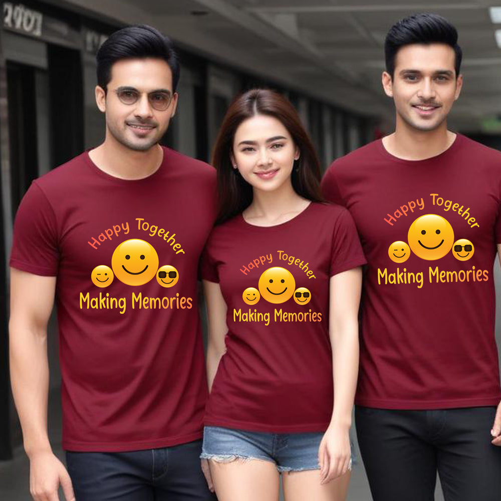 Three people wearing maroon t-shirts with a smiley face design and text.