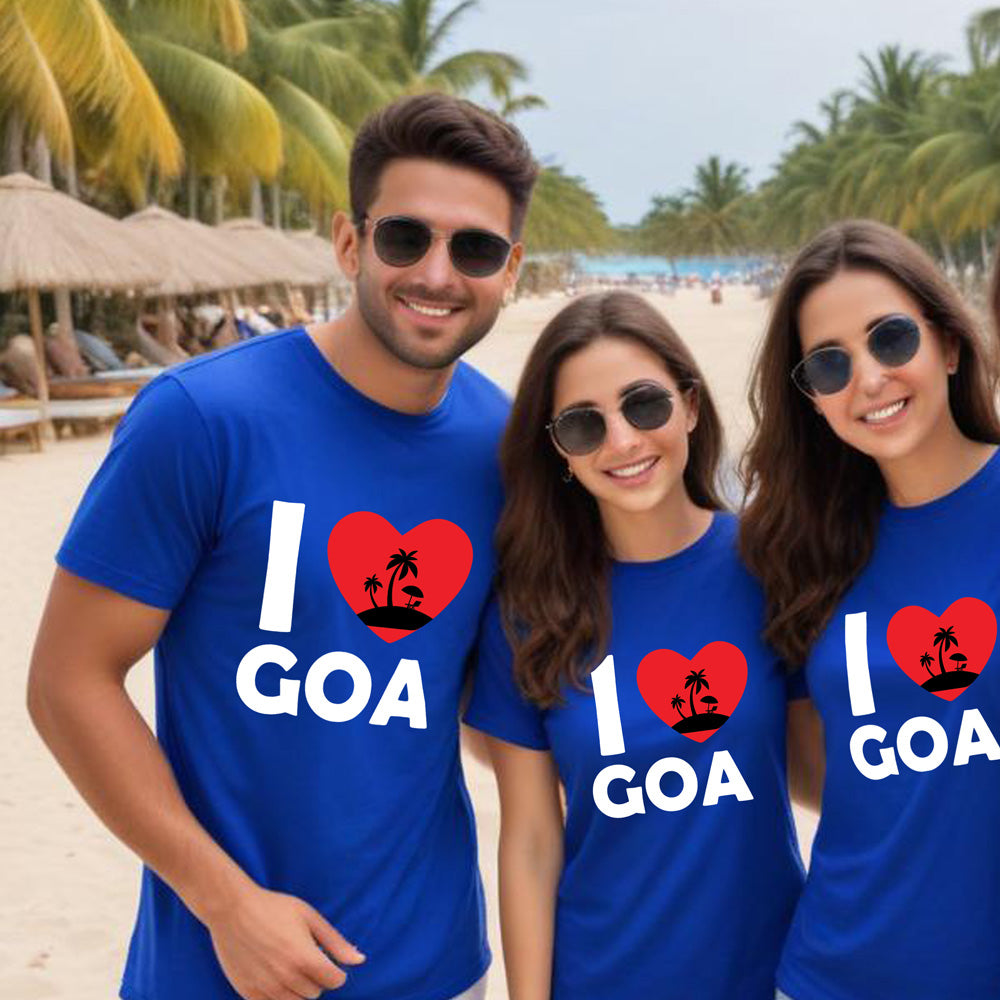 Three people wearing blue 'I ❤️ Goa' t-shirts on a beach.