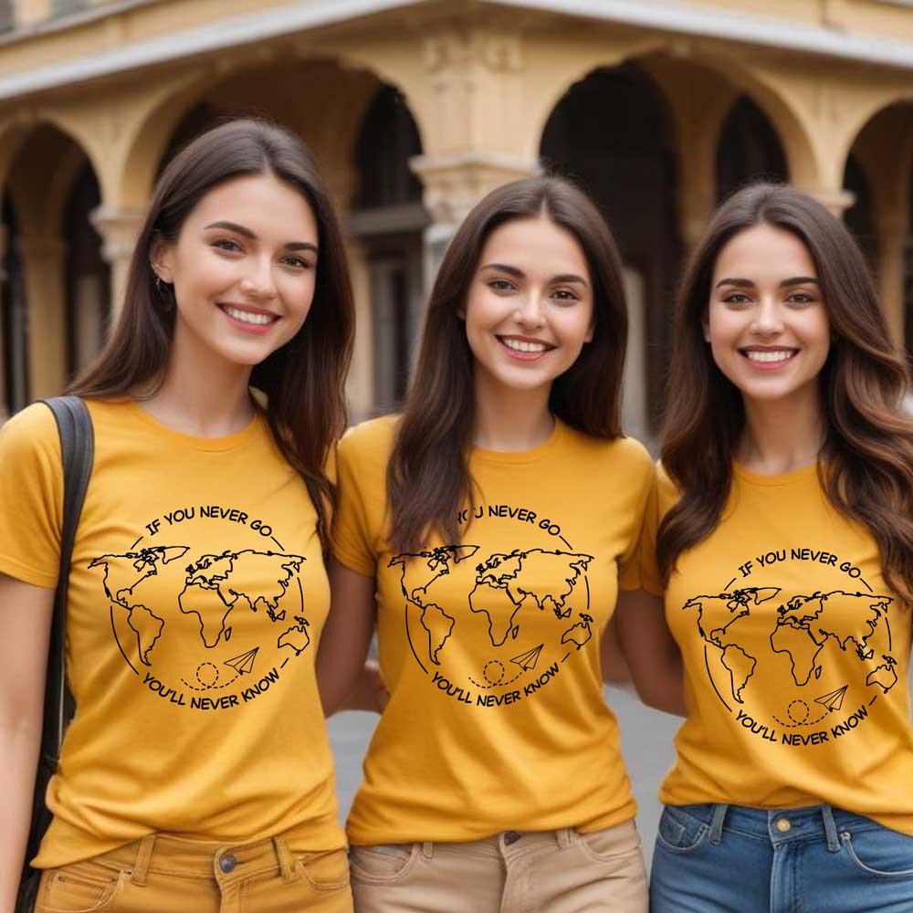Three women wearing yellow t-shirts with a world map design and text.