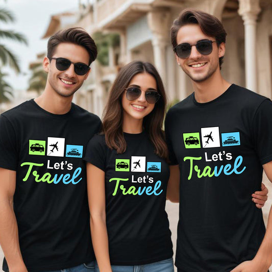 Three people wearing black t-shirts with 'Let's Travel' design outdoors.