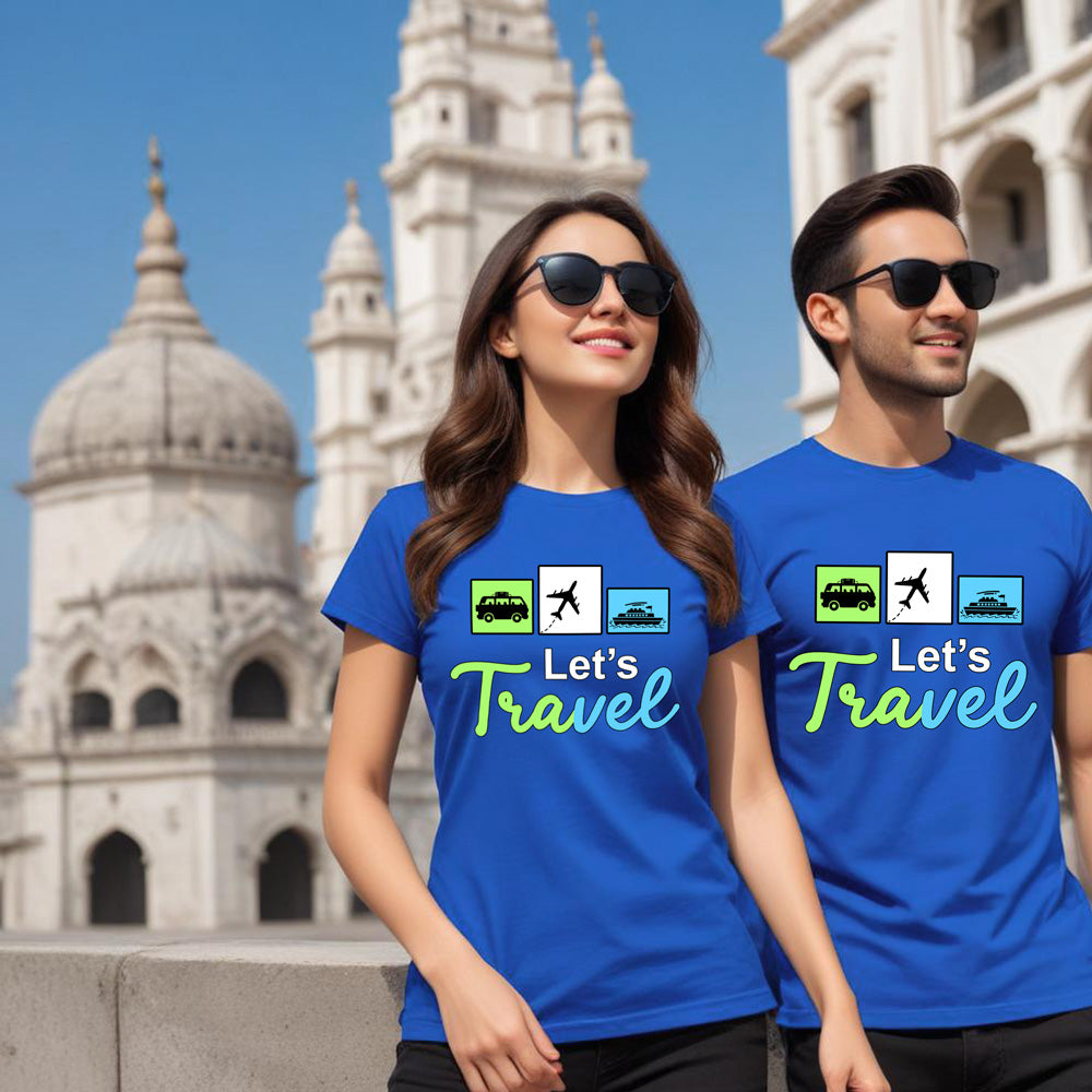 Two people wearing blue t-shirts with 'Let's Travel' text in front of a historical building.