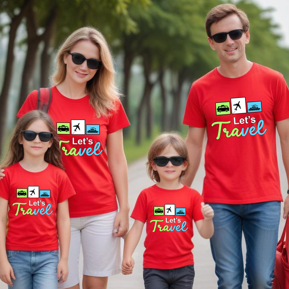 Family of four wearing red 'Let's Travel' t-shirts on a tree-lined path.