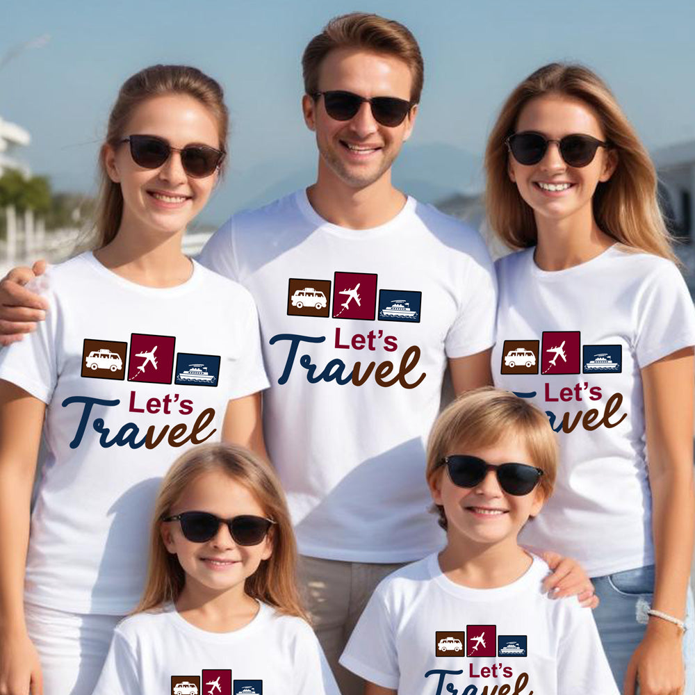 Family wearing matching 'Let's Travel' t-shirts with icons on a beach.
