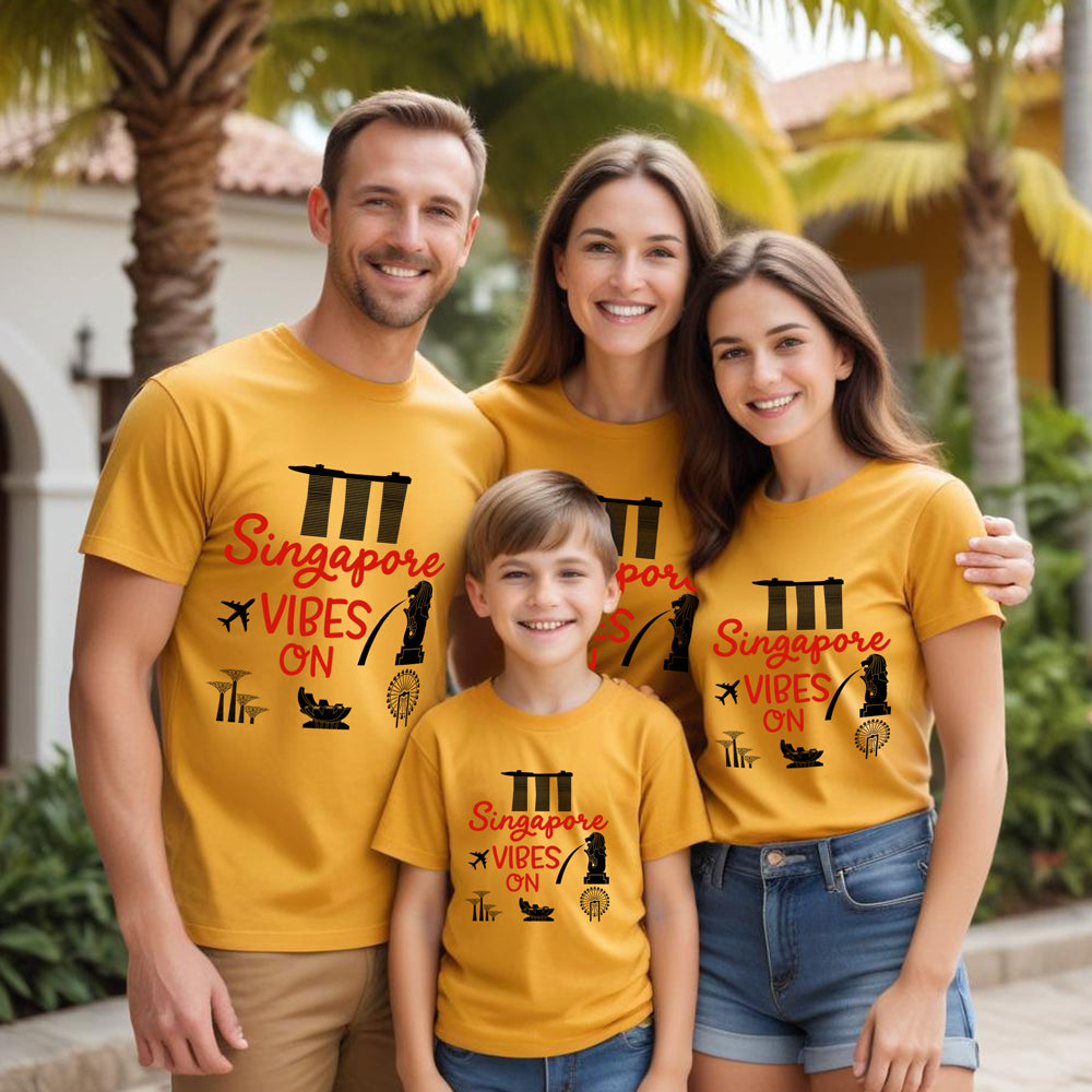 Family of four wearing matching yellow t-shirts with 'Singapore Vibes On' text.