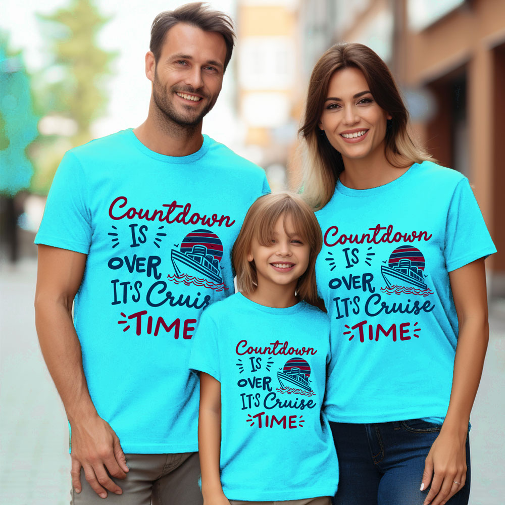 Family wearing matching blue t-shirts with a cruise-themed design.