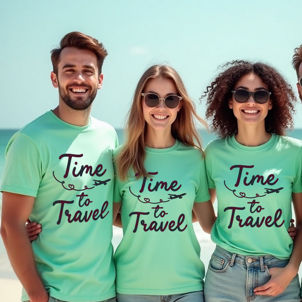 Three people wearing matching green t-shirts with 'Time to Travel' text on a beach.