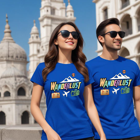 Two people wearing blue 'WANDERLUST' t-shirts in front of a historic building.