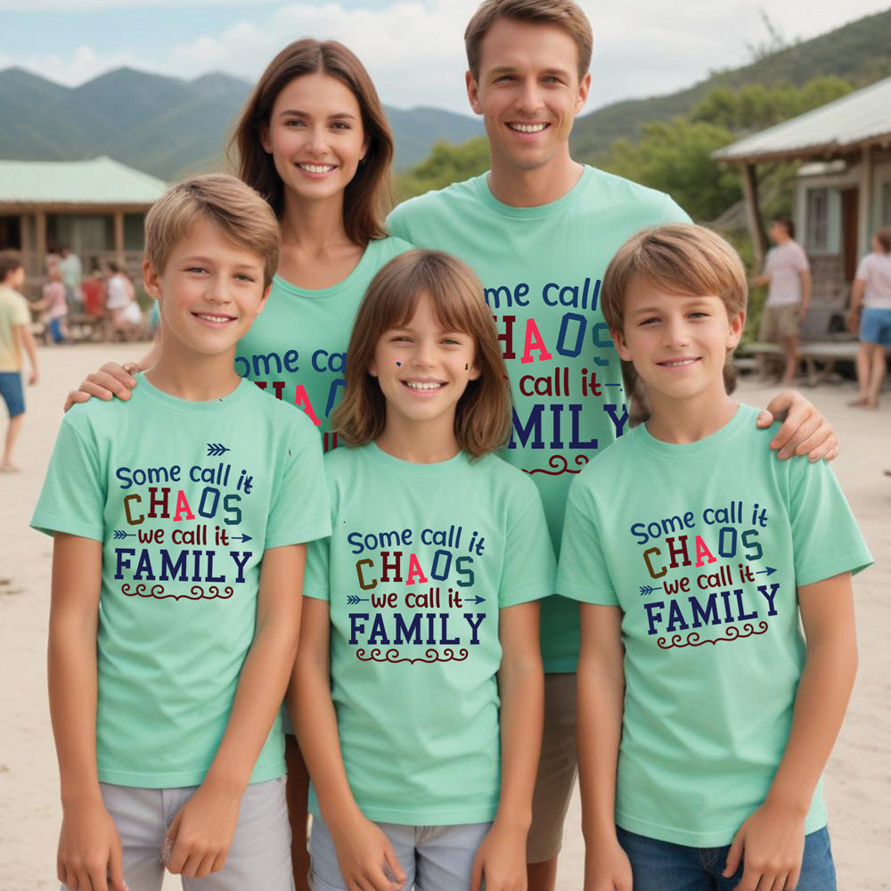 Family wearing matching teal t-shirts with a humorous family quote outdoors.